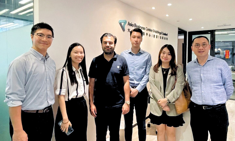 AsiaBC team with client after securing successful banking approval in Hong Kong.
