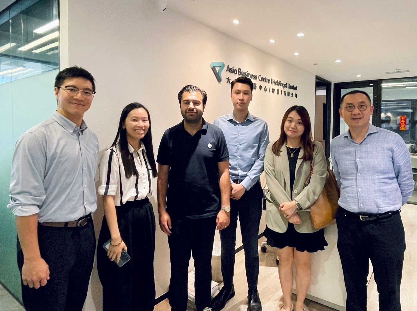 AsiaBC team with client after securing successful banking approval in Hong Kong.