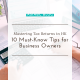 Work desk with a calculator, tax forms, & a laptop, highlighting AsiaBC's tips for mastering tax returns for HK entrepreneurs.