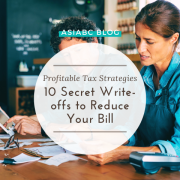 Small business owners organising tax documents with guidance from AsiaBC to ensure compliance & efficiency.