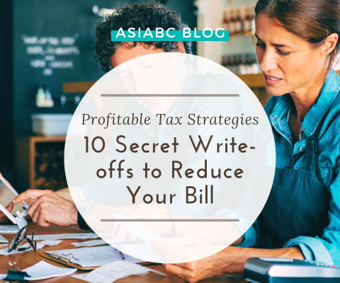 Small business owners organising tax documents with guidance from AsiaBC to ensure compliance & efficiency.